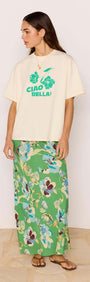 Model wearing Green Floral Bias Midi Skirt with a graphic tee, showcasing vibrant floral pattern and stylish design.