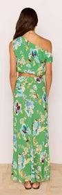 Model wearing the Green Floral Bias Midi Skirt, showcasing a vibrant floral pattern and flattering silhouette.