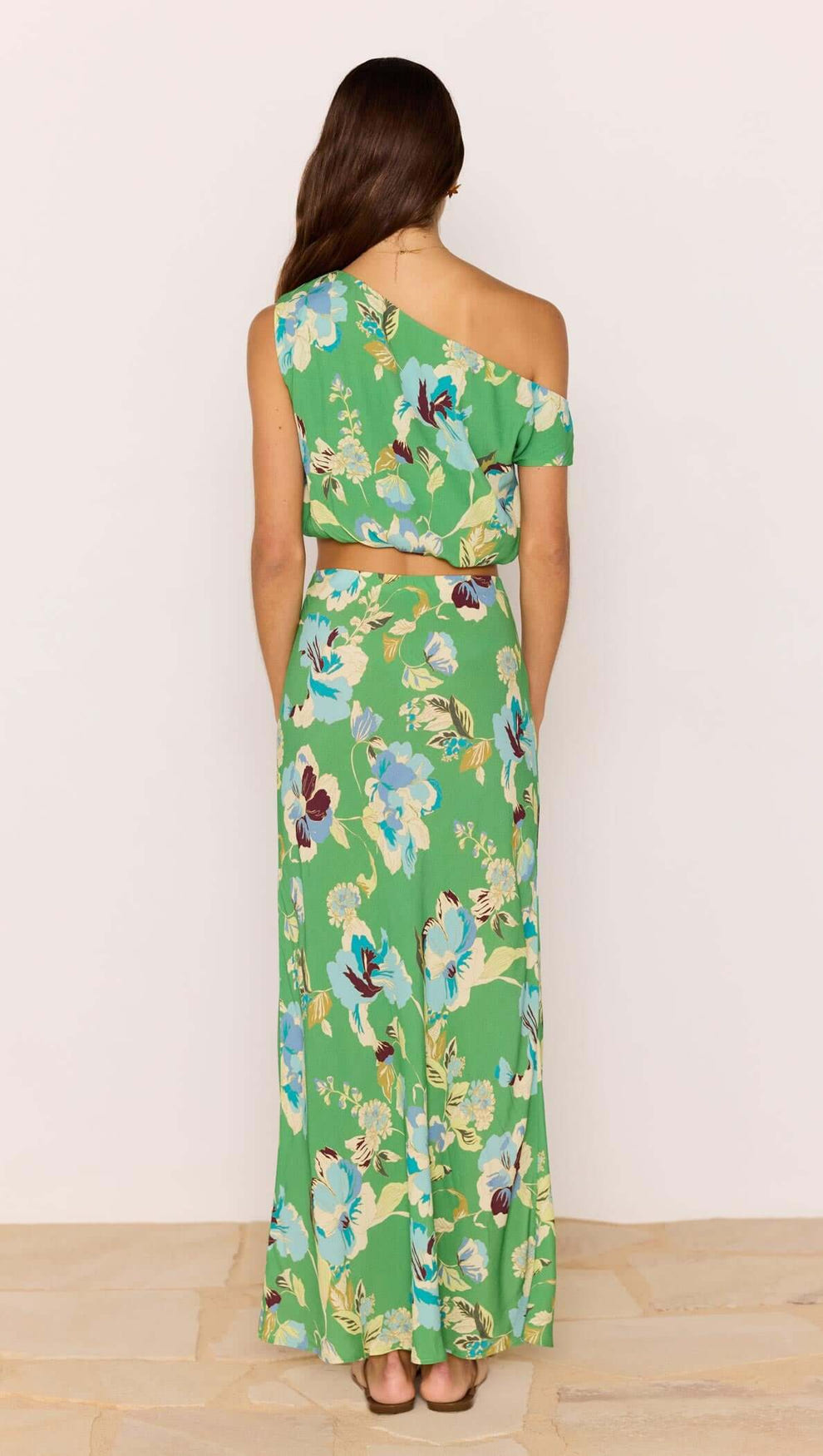 Model wearing the Green Floral Bias Midi Skirt, showcasing a vibrant floral pattern and flattering silhouette.