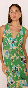 Model wearing the Green Floral Bias V-Neck Midi Dress with a vibrant floral pattern and a flattering silhouette.