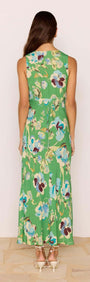 Back view of a model wearing the Green Floral Bias V-Neck Midi Dress showcasing its flowy design and vibrant floral print.