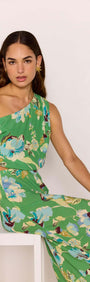 Model showcasing the Green Floral Crop Top with one-shoulder design in a vibrant floral print, perfect for summer.
