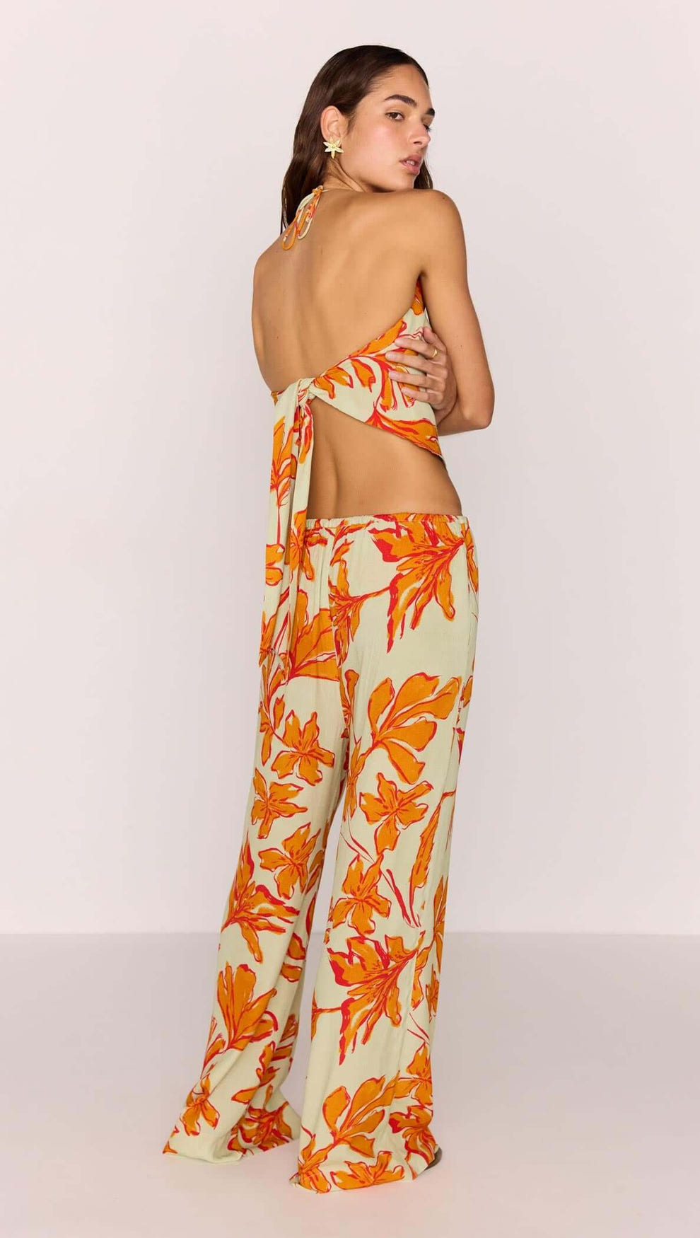 Green & Orange Floral Cowl Neck Scarf Top worn with matching Estelle Drawstring Pant, showcasing backless halter style.