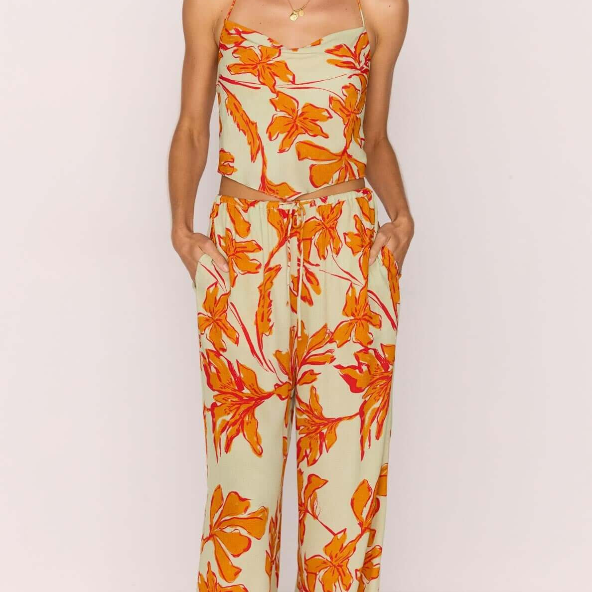 Green & Orange Floral Drawstring Wide Leg Pant worn by model with floral patterns in orange and green.