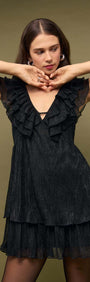 Black Shimmer Plisse Frill Mini Dress featuring layered ruffles and a deep V neckline on a model.
