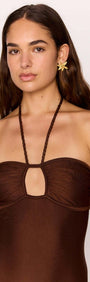 Model wearing a Halter-Neck One Piece Swimsuit in Chocolate Brown with Cut-Out Detail, hair down and earrings.