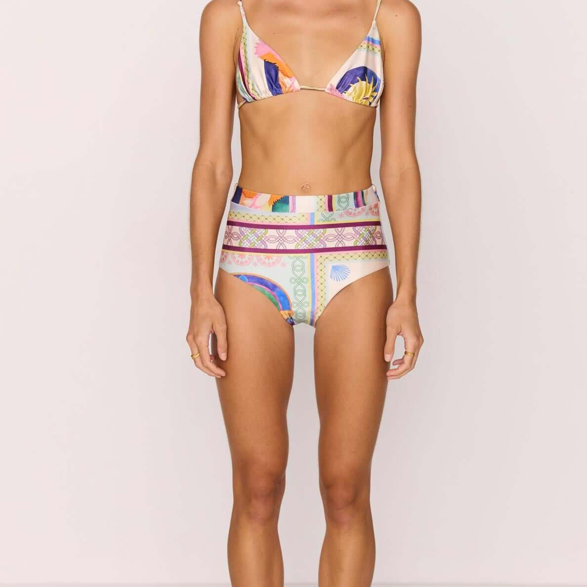Model wearing a High-Waist Bikini Pant in vibrant multicolour print, showcasing a stylish summer look.
