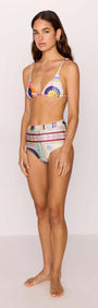 Model wearing a high-waist bikini pant in multicolour print, styled with a matching bikini top, showcasing retro-inspired design.