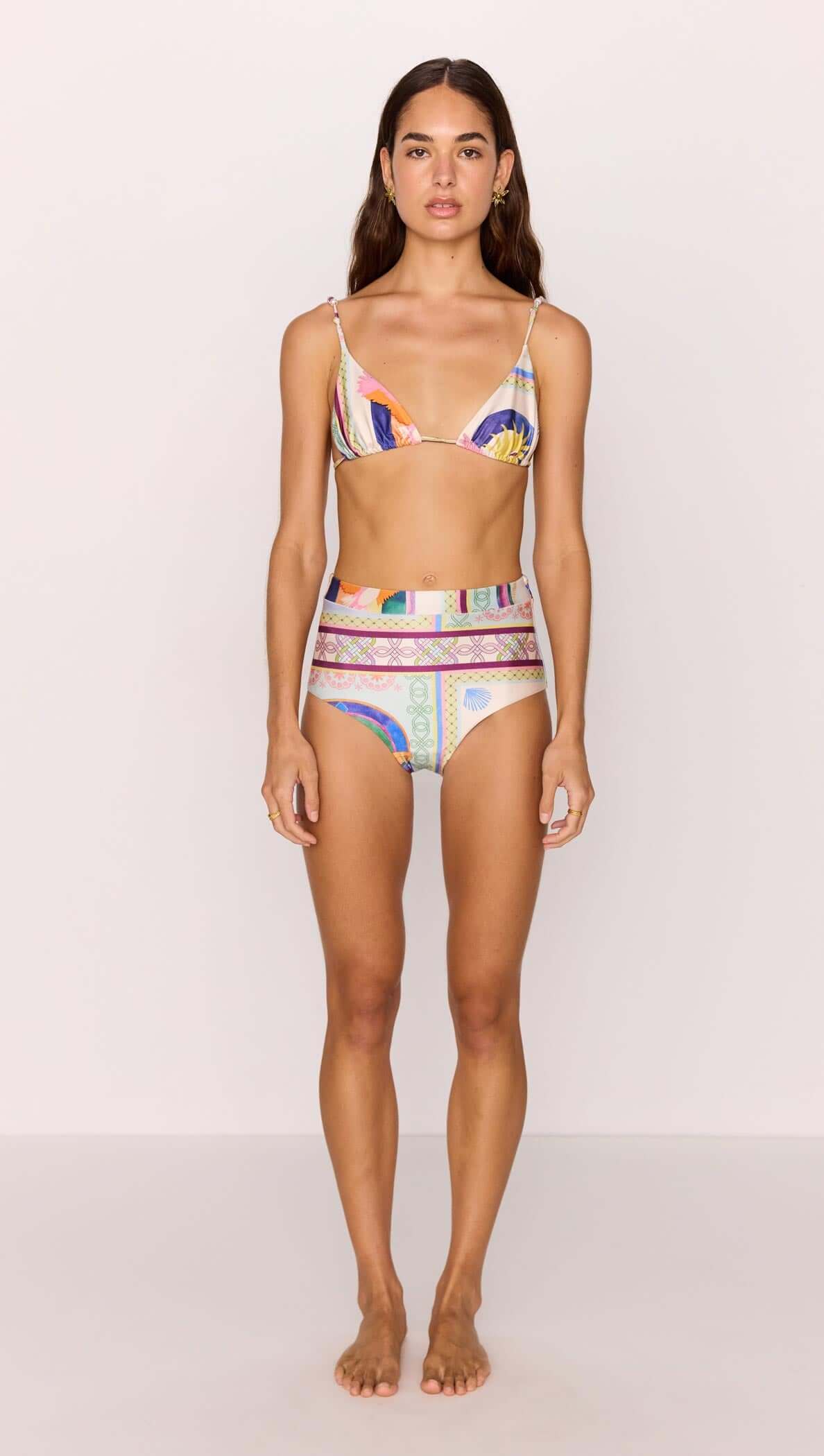 Model wearing a High-Waist Bikini Pant in vibrant multicolour print, showcasing a stylish summer look.