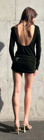 Green Velvet Open Back Mini Dress showcased from behind, featuring a daring open back and ruched skirt.