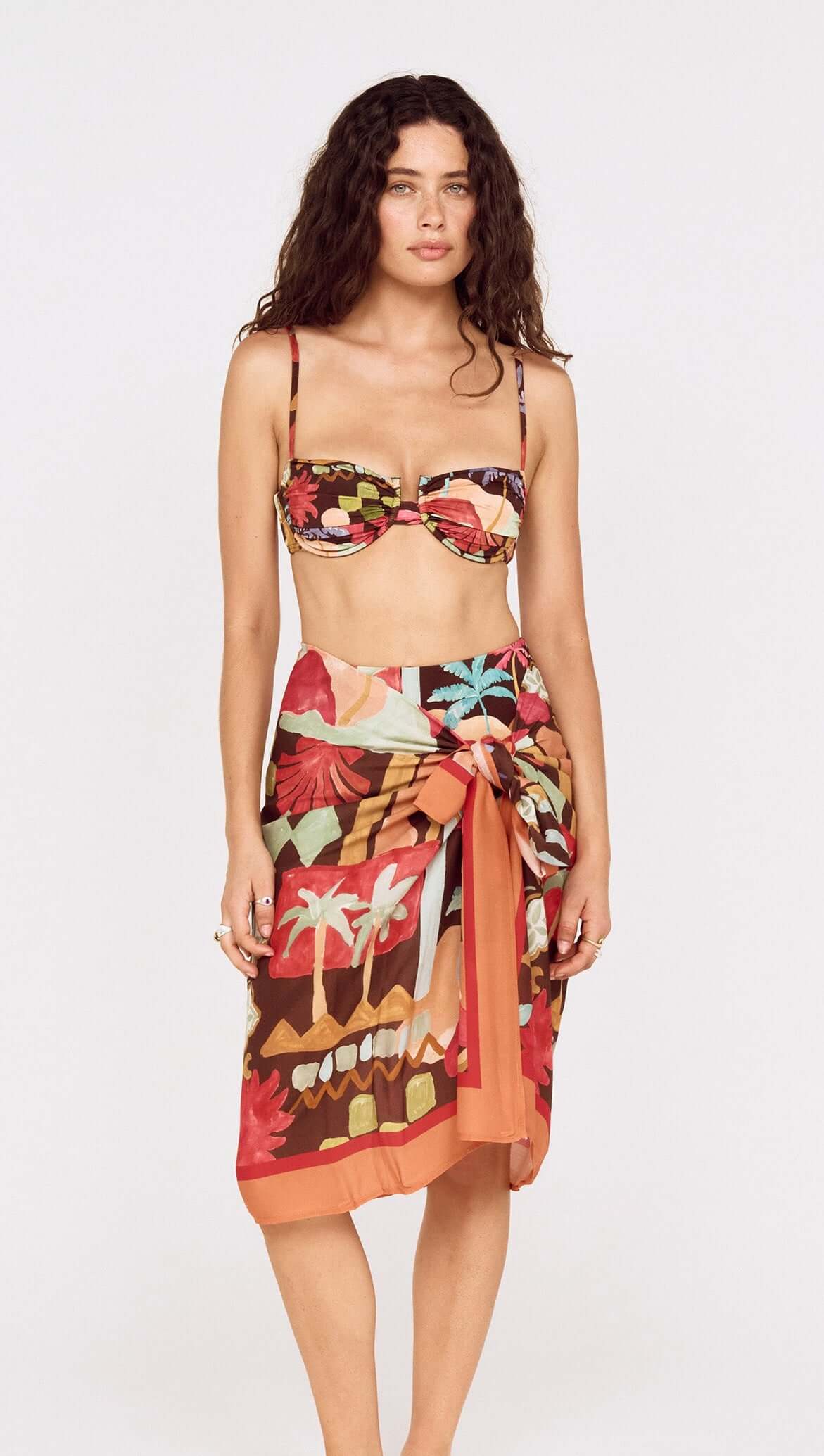 Model wearing Vinatage Coastal Print Long Sarong with tropical design, perfect for resort styling.