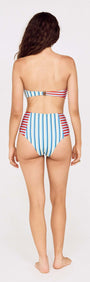 Back view of a woman wearing a Contrast Stripe High Waisted Bikini Bottom with colorful vertical stripes.
