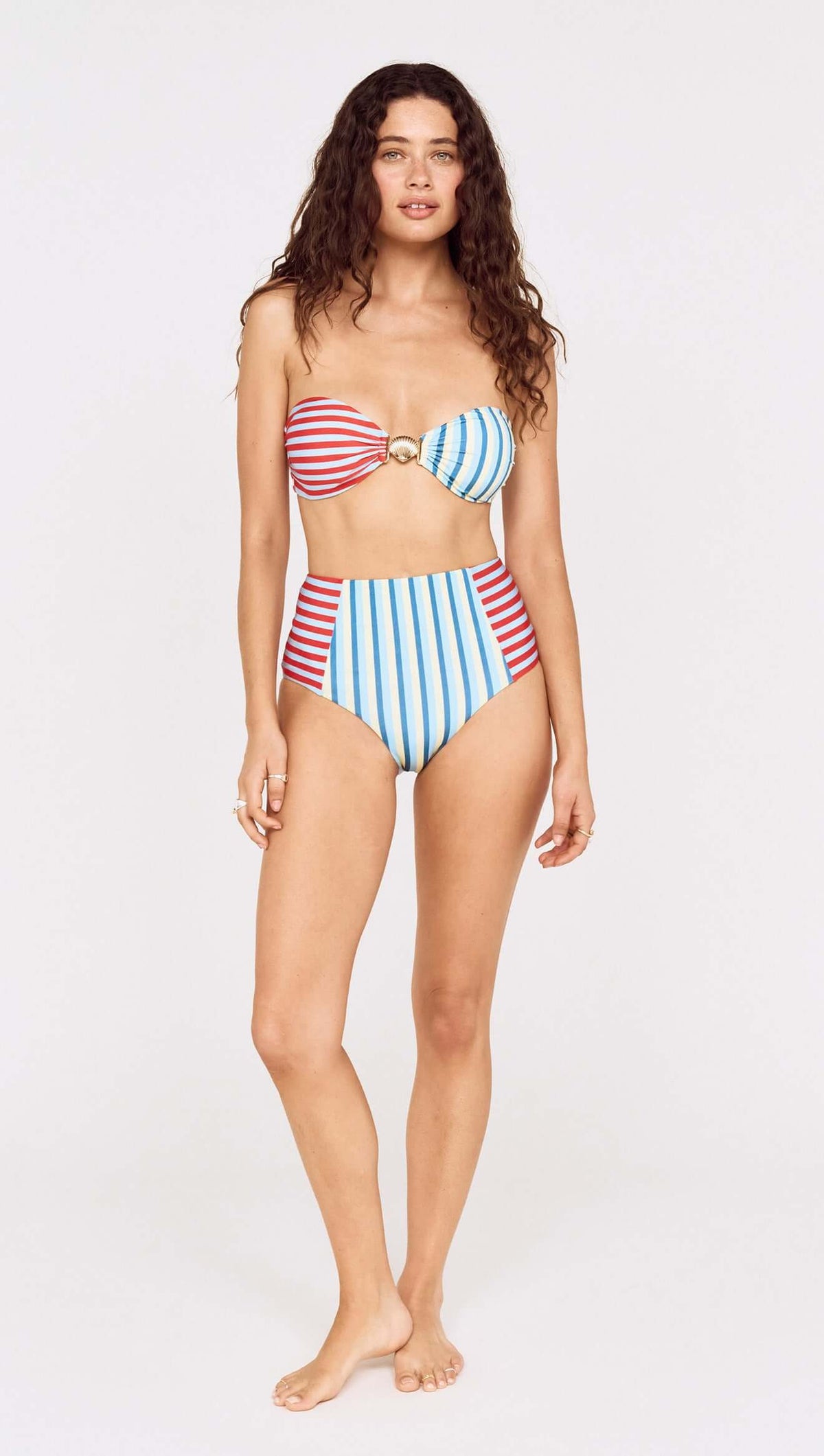 Model wearing a Contrast Stripe High Waisted Bikini Bottom with colorful stripes and a stylish bandeau top.