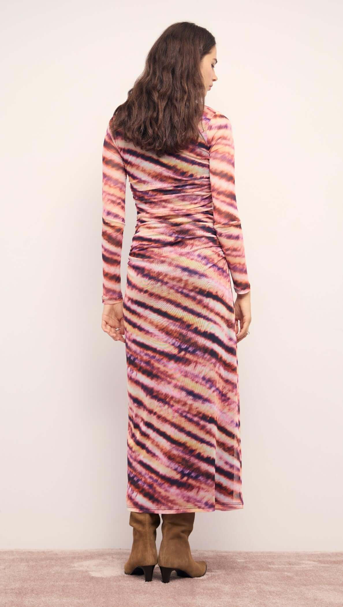 Back view of the Pink &amp; Purple Striped Mesh Midi Dress featuring a ruched design and long sleeves, perfect for stylish occasions.