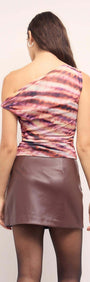 Back view of a woman wearing a Pink & Purple Striped Mesh Top with one shoulder and stylish ruched sides.