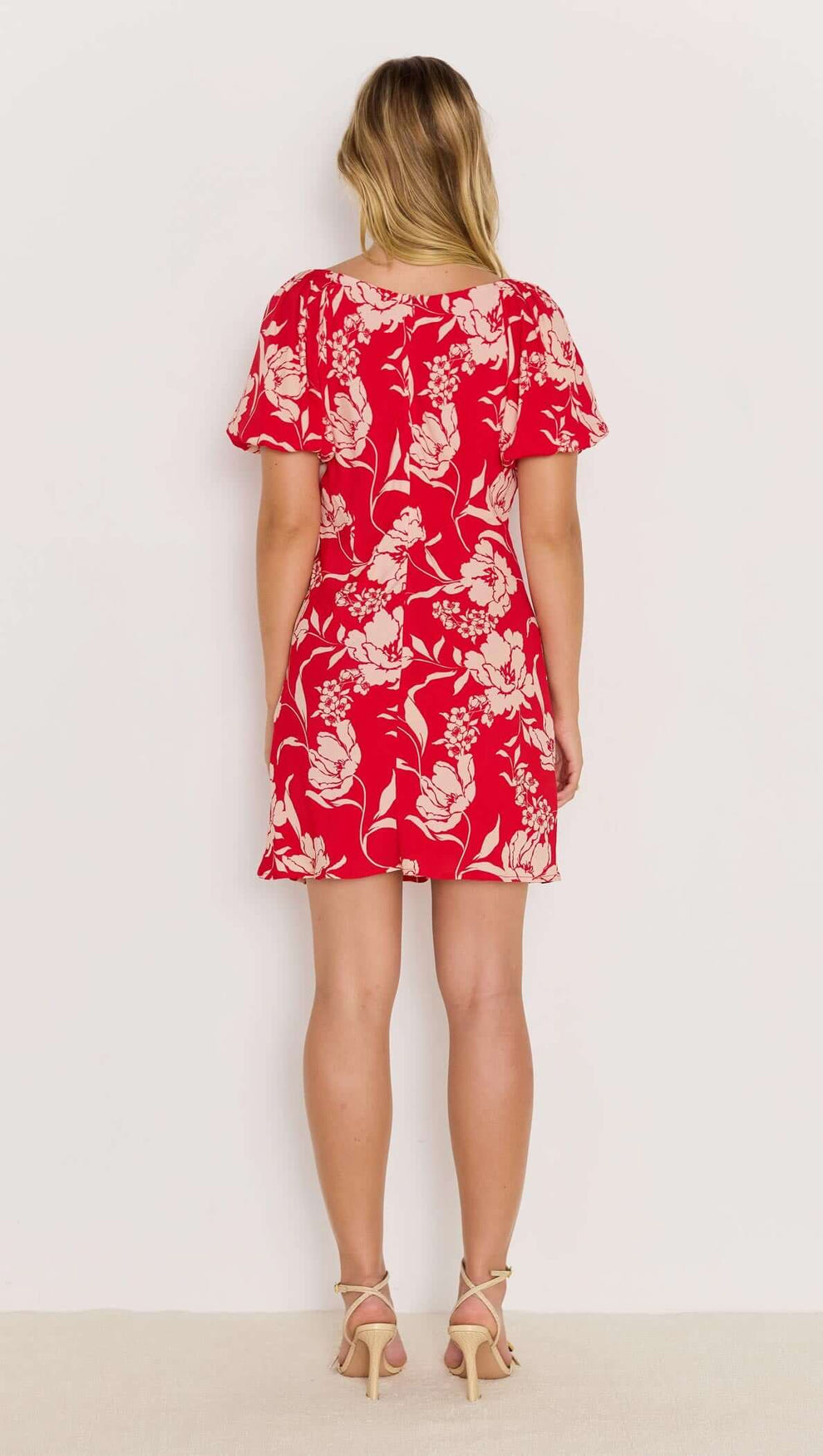 Back view of the Poppy Mini Dress in bold red floral print with floaty short sleeves and mini length.