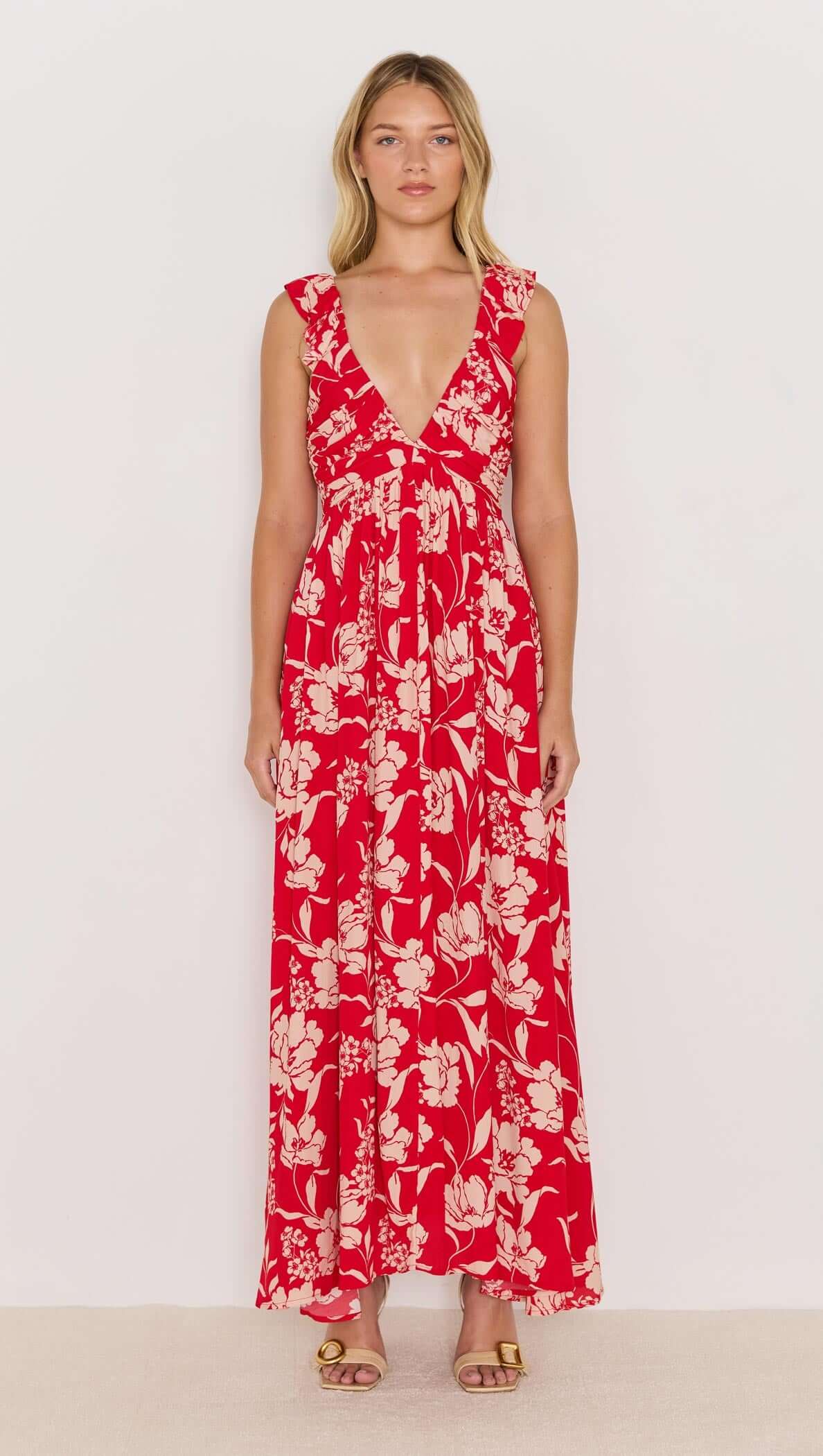 Poppy Maxi Dress in red floral print, featuring wide ruffle straps and a deep V neckline, perfect for summer days and nights.