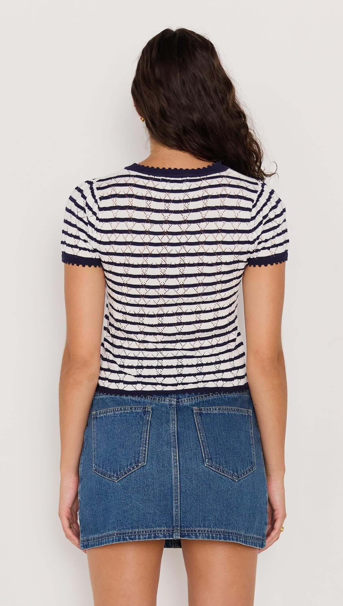 Back view of the CHLOE STRIPE KNIT TEE in navy and white stripes with intricate pointelle texture and short sleeves.