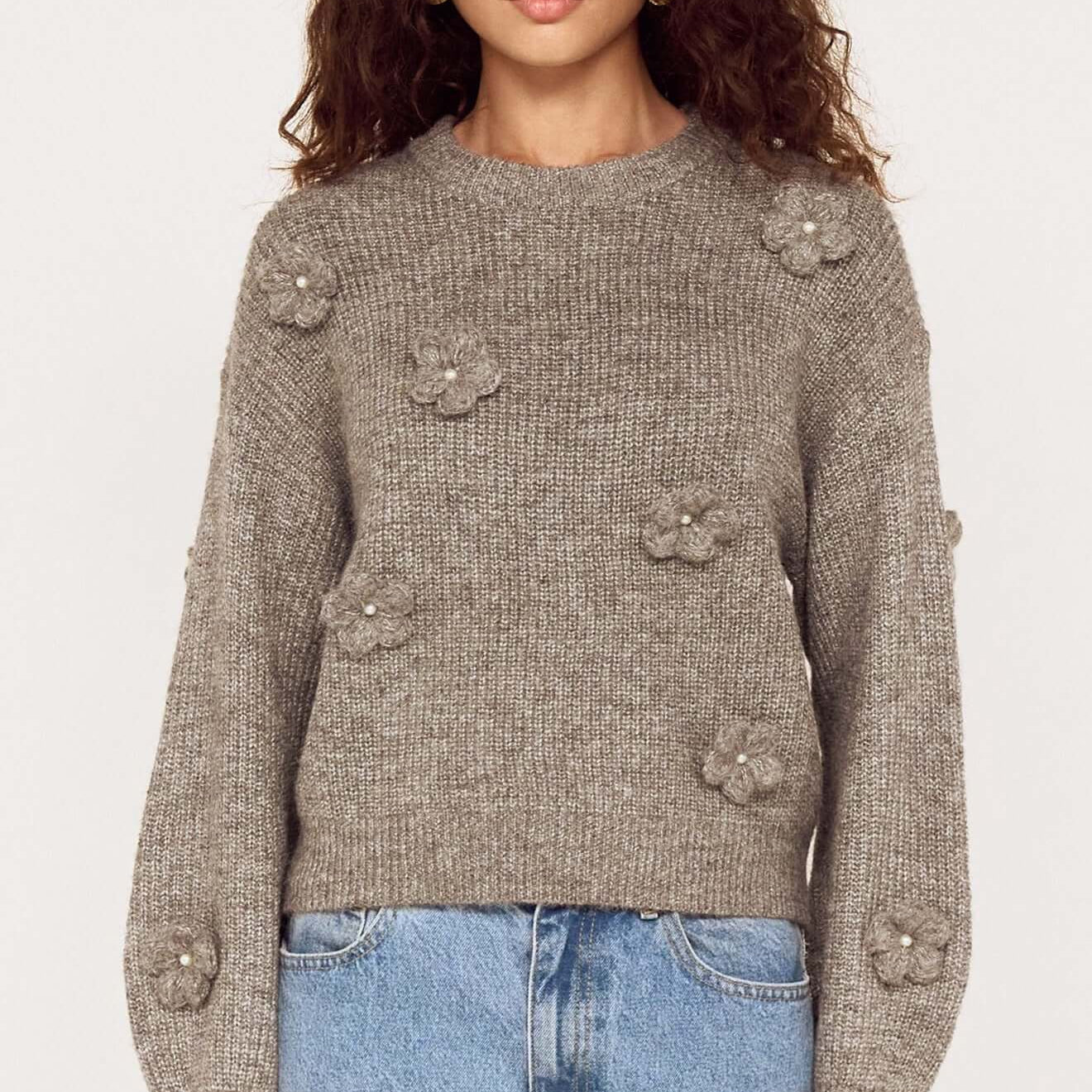 Round Neck Grey Floral Applique Jumper featuring floral appliqué and pearl accents, styled with denim.