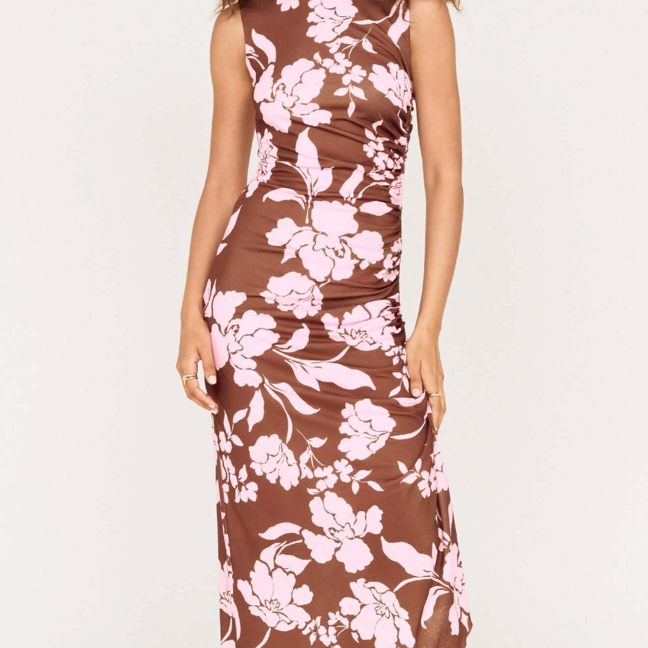 Sleeveless Pink Floral Mesh Midi Dress displayed on a model, featuring oversized floral print and fitted silhouette.