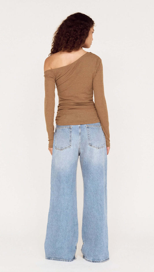 Back view of Coffee Off Shoulder Mesh Top with Tie Detail paired with wide-leg jeans, showcasing a chic casual style.