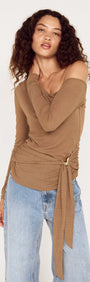 Coffee Off Shoulder Mesh Top with Tie Detail modeled by a woman, showcasing its stylish design and fit.