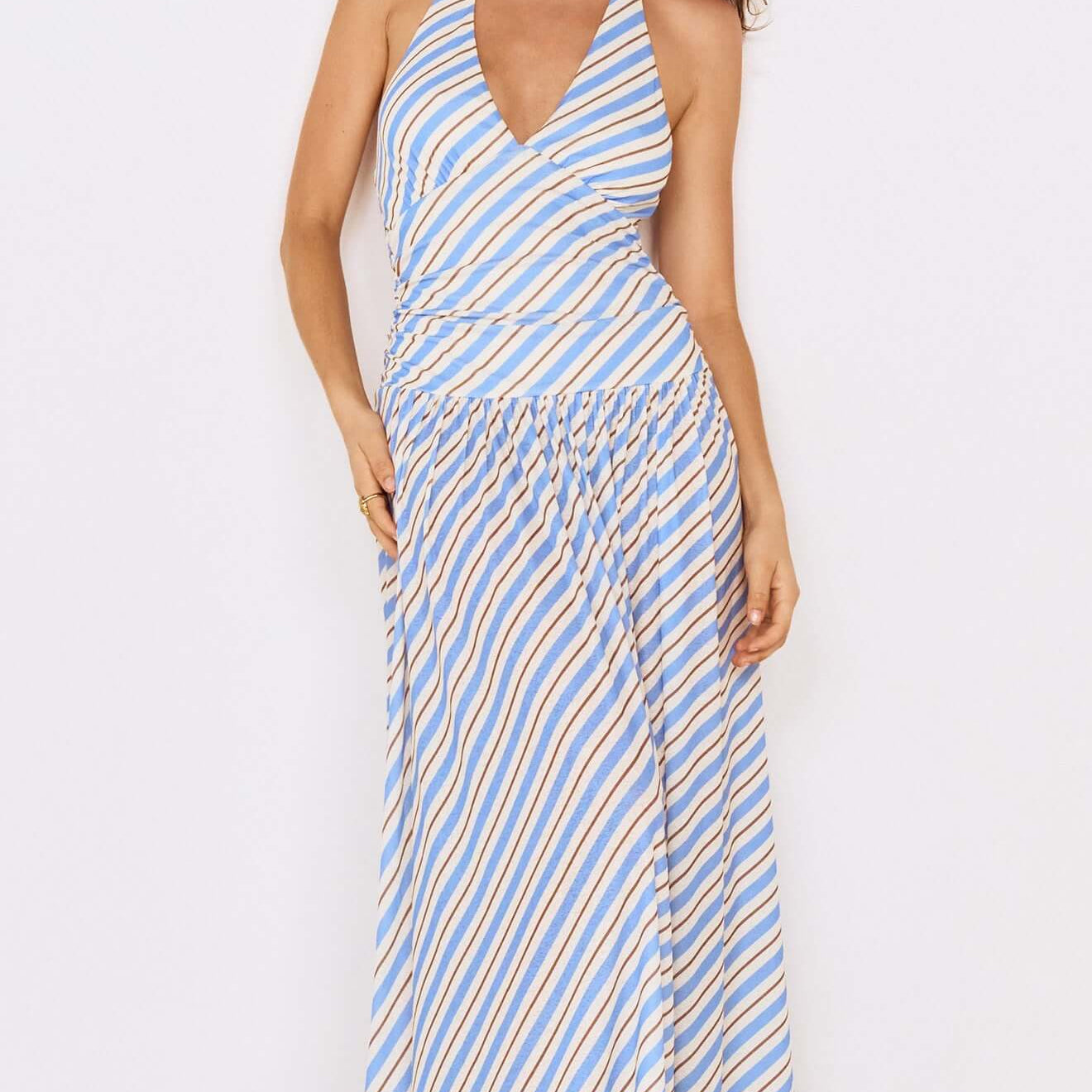 Blue Stripe Halter Neck Midi Dress on a model with flowing hair, showcasing a stylish summer look.
