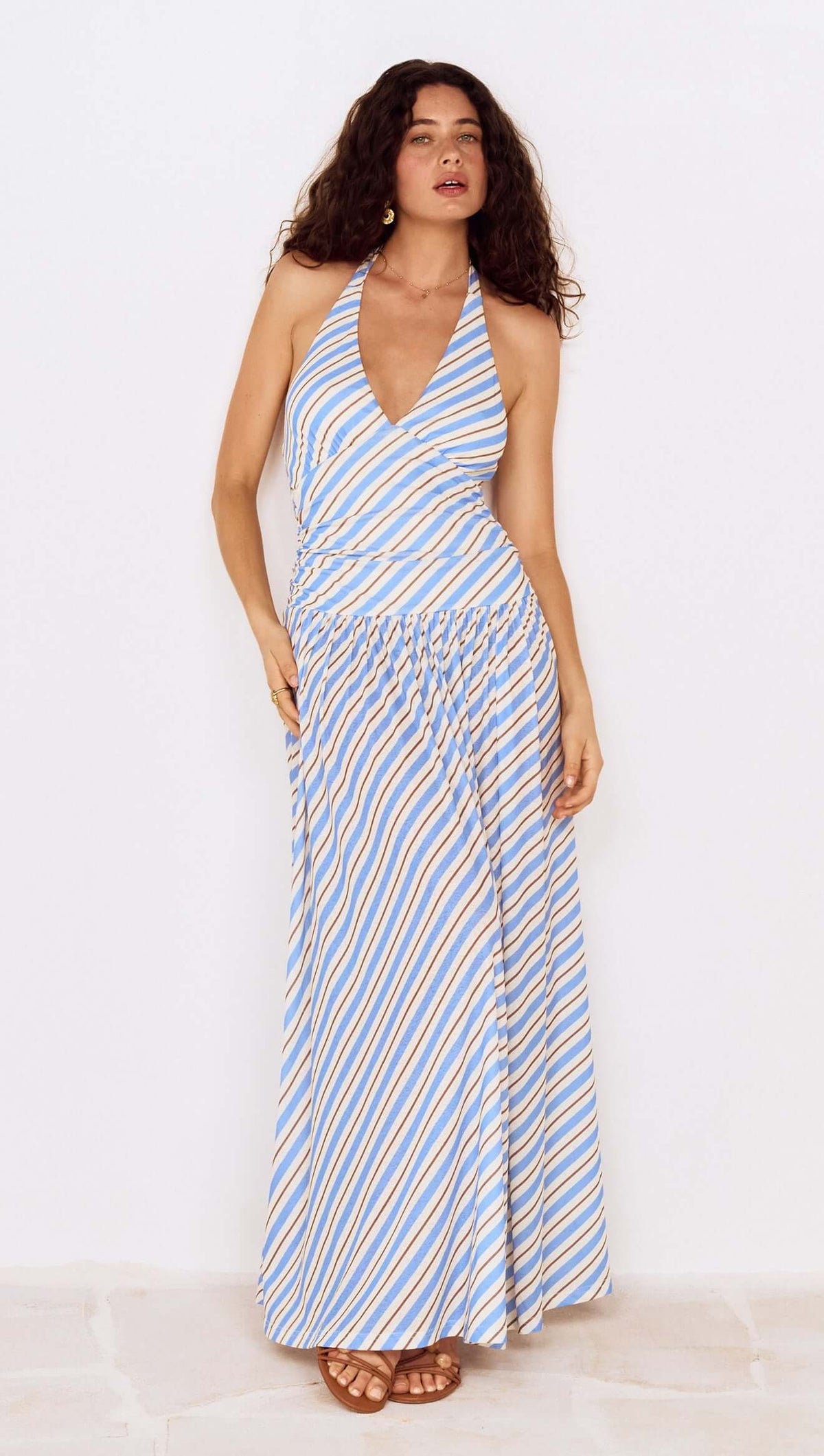Blue Stripe Halter Neck Midi Dress on a model with flowing hair, showcasing a stylish summer look.