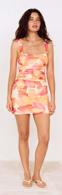 Sunset Leaf Print Gathered Mini Dress featuring vibrant tropical-inspired print and flattering ruching design.