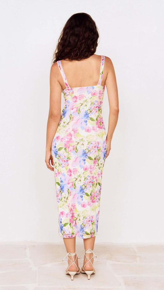 Back view of model wearing Watercolour Floral Mesh Midi Dress with floral pattern and spaghetti straps.