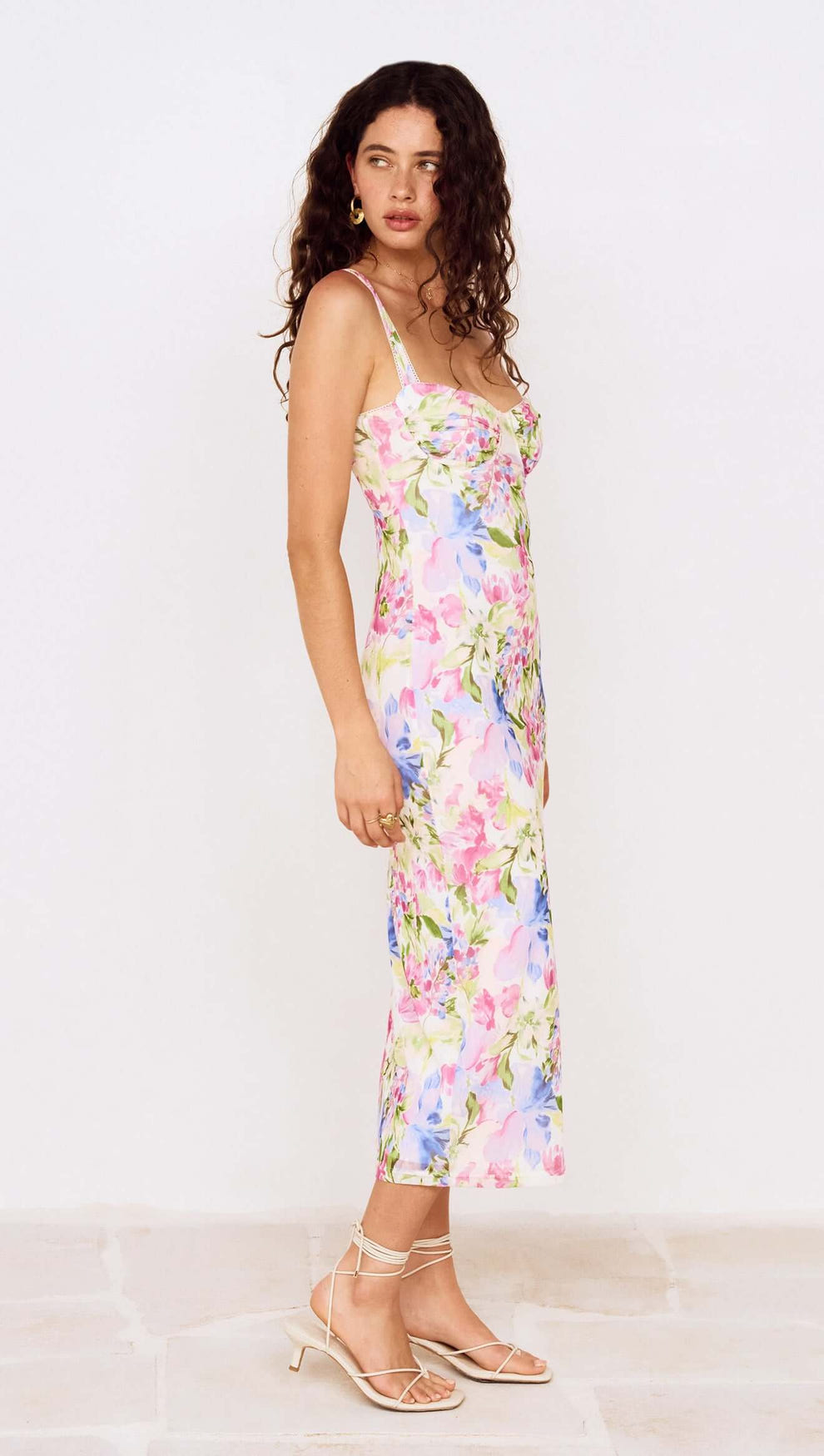 Model showcasing the Watercolour Floral Mesh Midi Dress with multicolored floral print, perfect for occasion dressing.