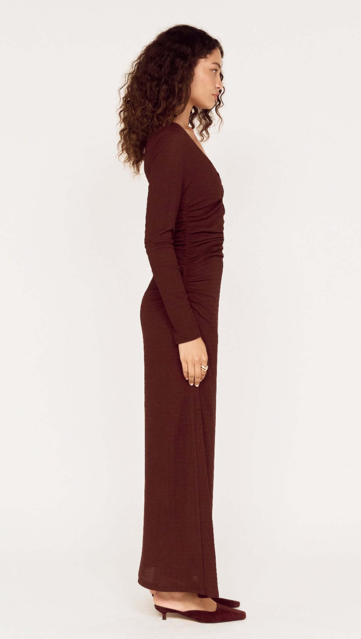 Side view of U Wire Textured Jersey Midi Dress in Chocolate, showcasing its elegant silhouette and textured fabric.