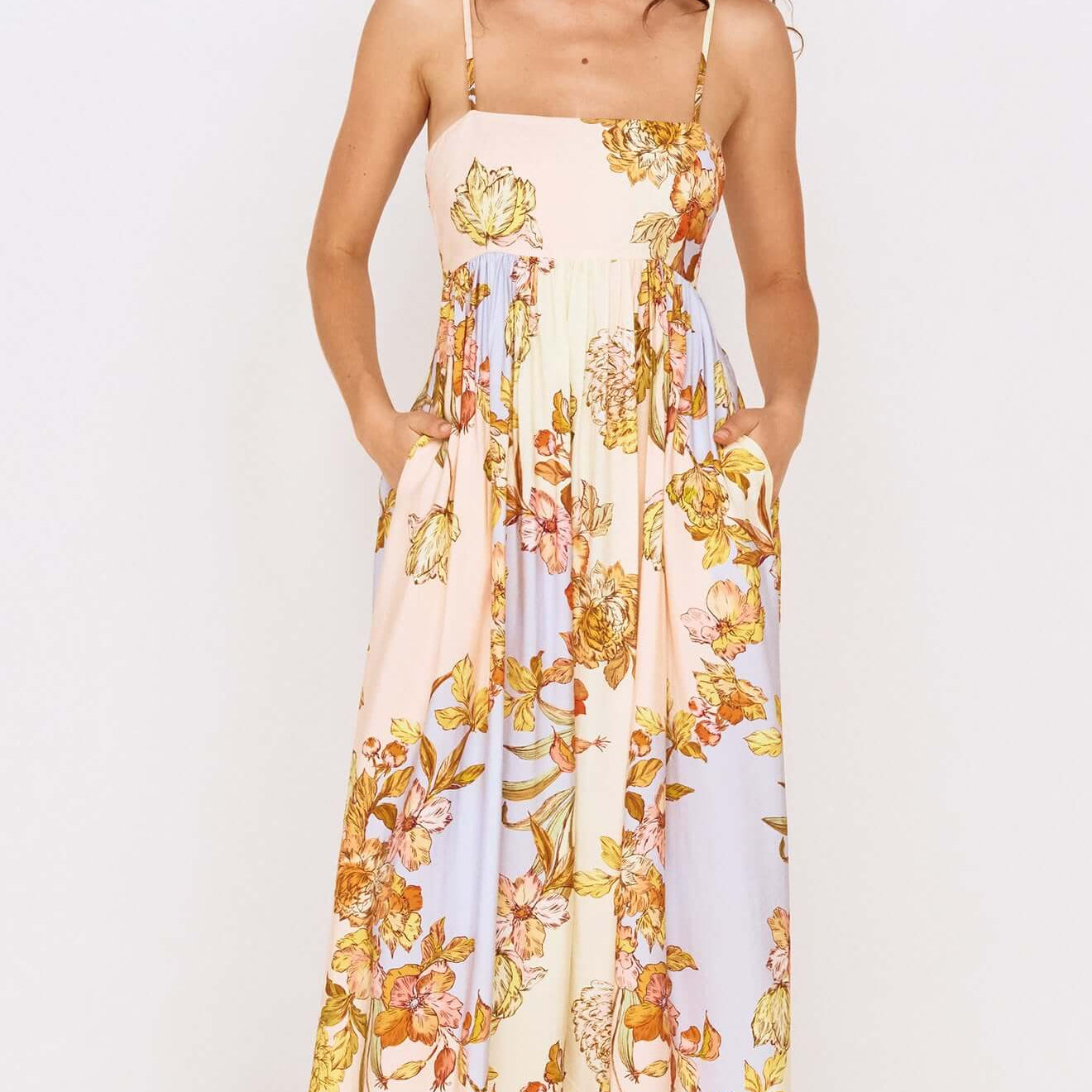 Pastel Floral Tie Detail Maxi Dress featuring a soft floral print and flowing silhouette with adjustable straps.