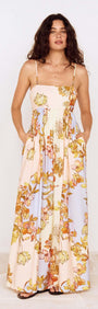 Pastel Floral Tie Detail Maxi Dress featuring a soft floral print and flowing silhouette with adjustable straps.