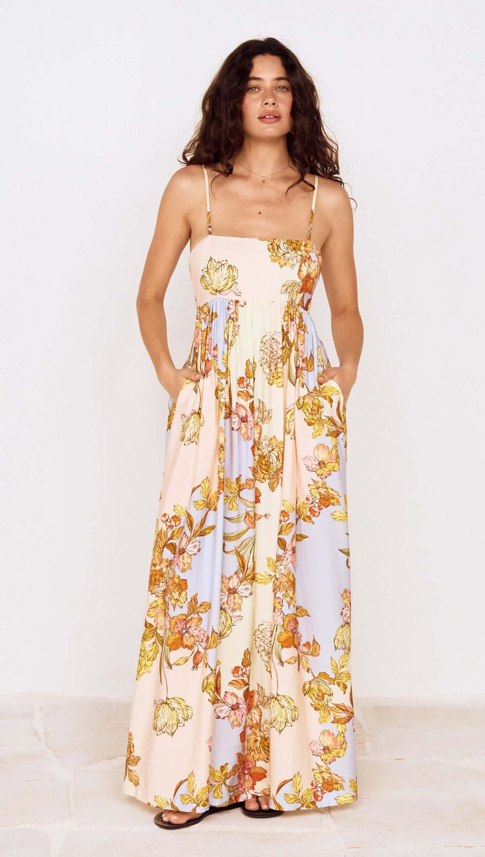 Pastel Floral Tie Detail Maxi Dress featuring a soft floral print and flowing silhouette with adjustable straps.