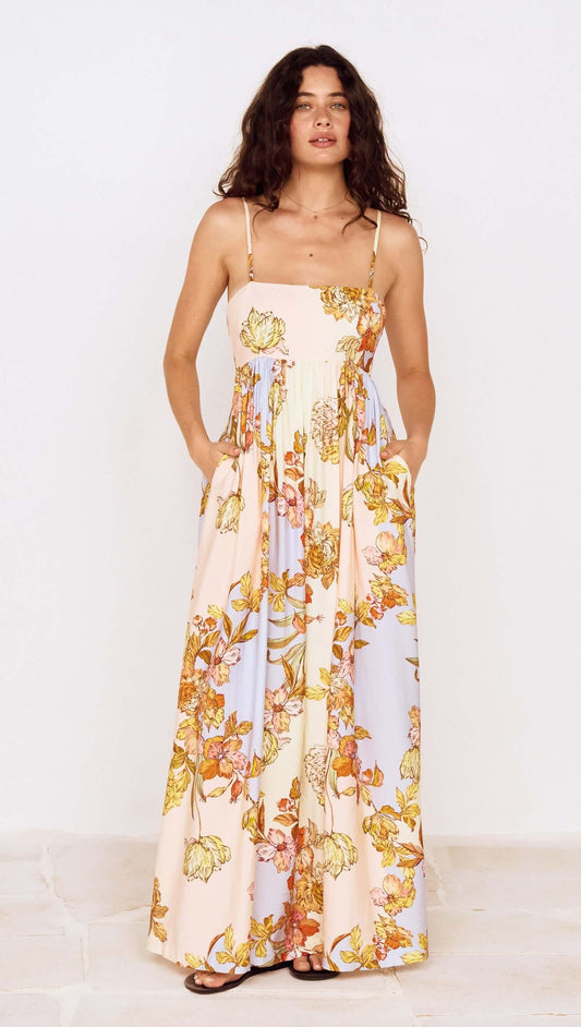 Pastel Floral Tie Detail Maxi Dress featuring a soft floral print and flowing silhouette with adjustable straps.