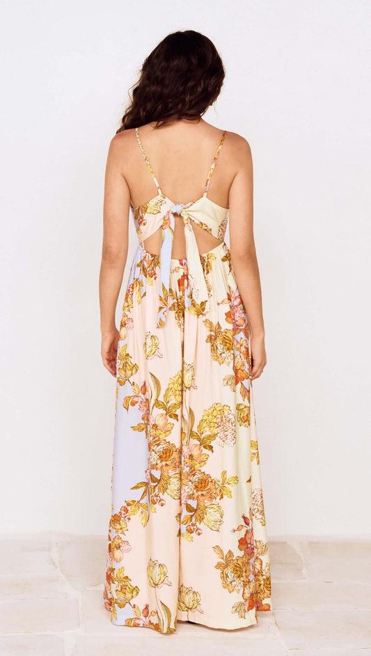 Back view of the Pastel Floral Tie Detail Maxi Dress with a floral print and open tie-back detail.