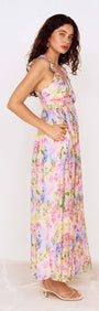 Watercolour Floral Ruffle Maxi Dress showcased from the side, featuring a pastel floral print and ruffle shoulder straps.