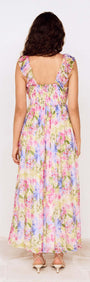 Watercolour Floral Ruffle Maxi Dress showing the back view with ruffle shoulder straps and colorful floral pattern.
