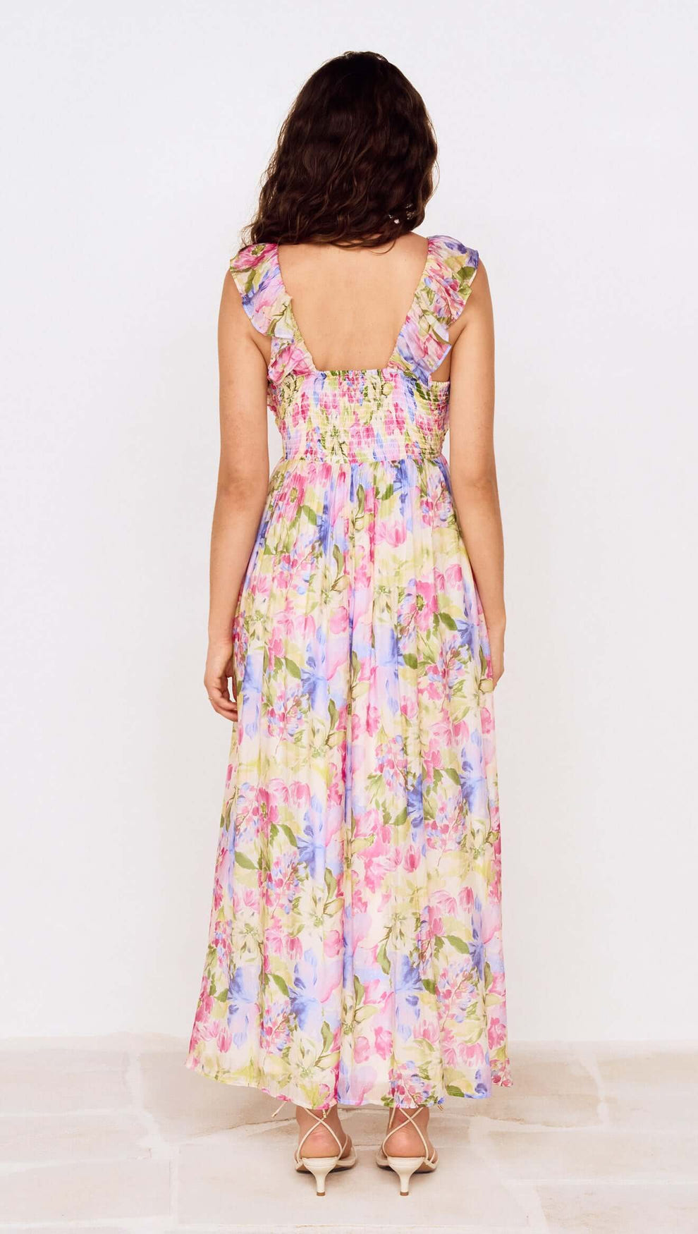 Watercolour Floral Ruffle Maxi Dress showing the back view with ruffle shoulder straps and colorful floral pattern.