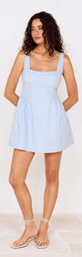 Model wearing a Baby Blue Square Neck Mini Dress, showcasing a fashionable summer look with a relaxed fit.