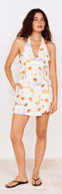 Model wearing a Fruit Print Halter Neck Romper with vibrant fruit patterns, perfect for summer styling.
