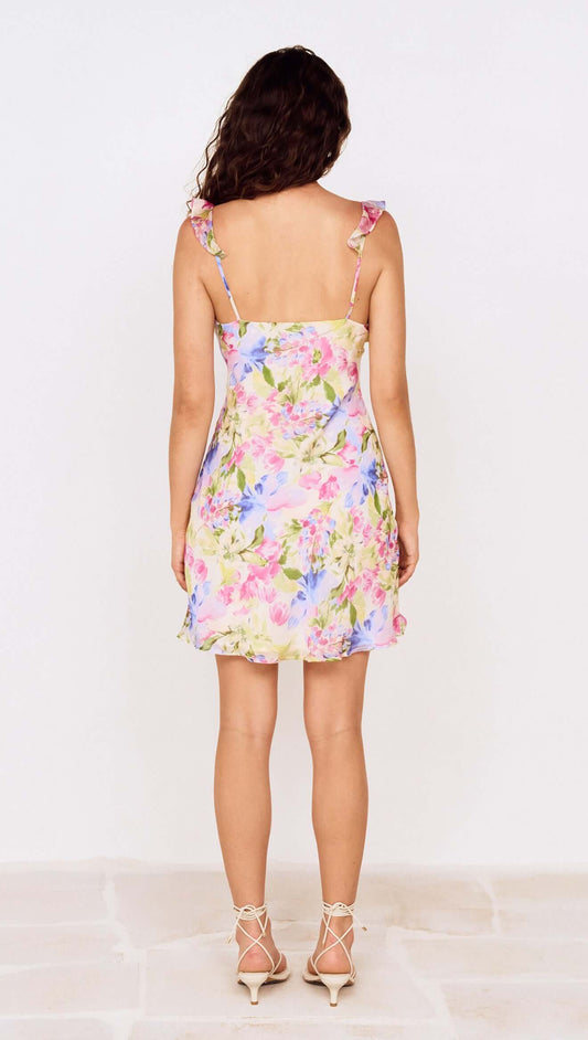 Back view of Watercolour Floral Mini Dress with Frill Trim featuring colorful floral design and adjustable straps.