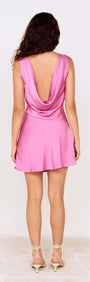 Fuchsia Cowl Back Bias Mini Dress displayed from the back, showcasing its elegant drape and playful style.