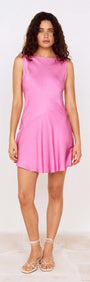 Fuchsia Cowl Back Bias Mini Dress worn by a model, showcasing its elegant design and vibrant color.