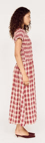 Short Sleeve Shirred Check Midi Dress shown on a model in profile view, featuring a red and white checked pattern.