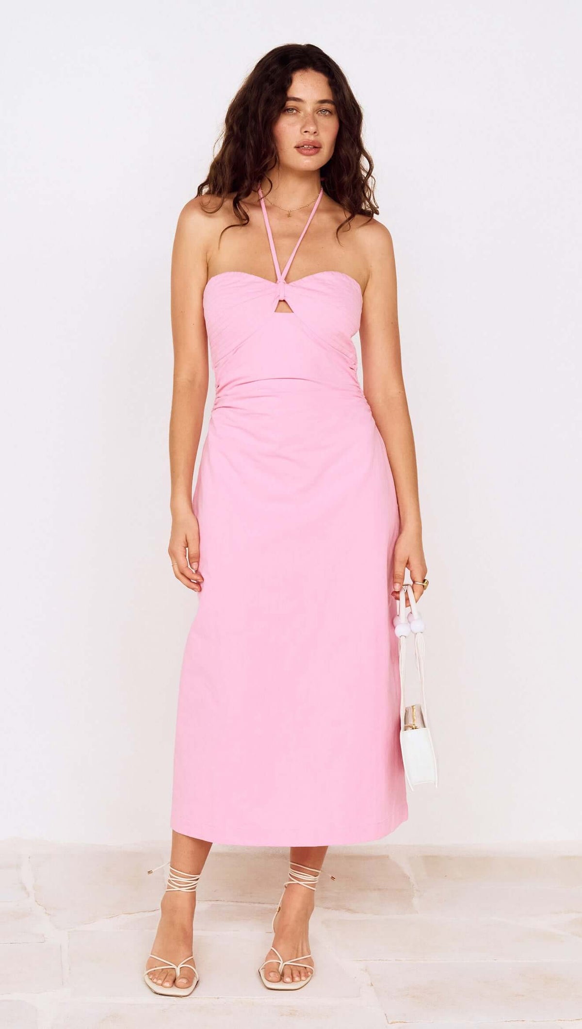 Pink Keyhole Detail Halter Neck Midi Dress worn by a model, showcasing its stylish design and elegant silhouette.