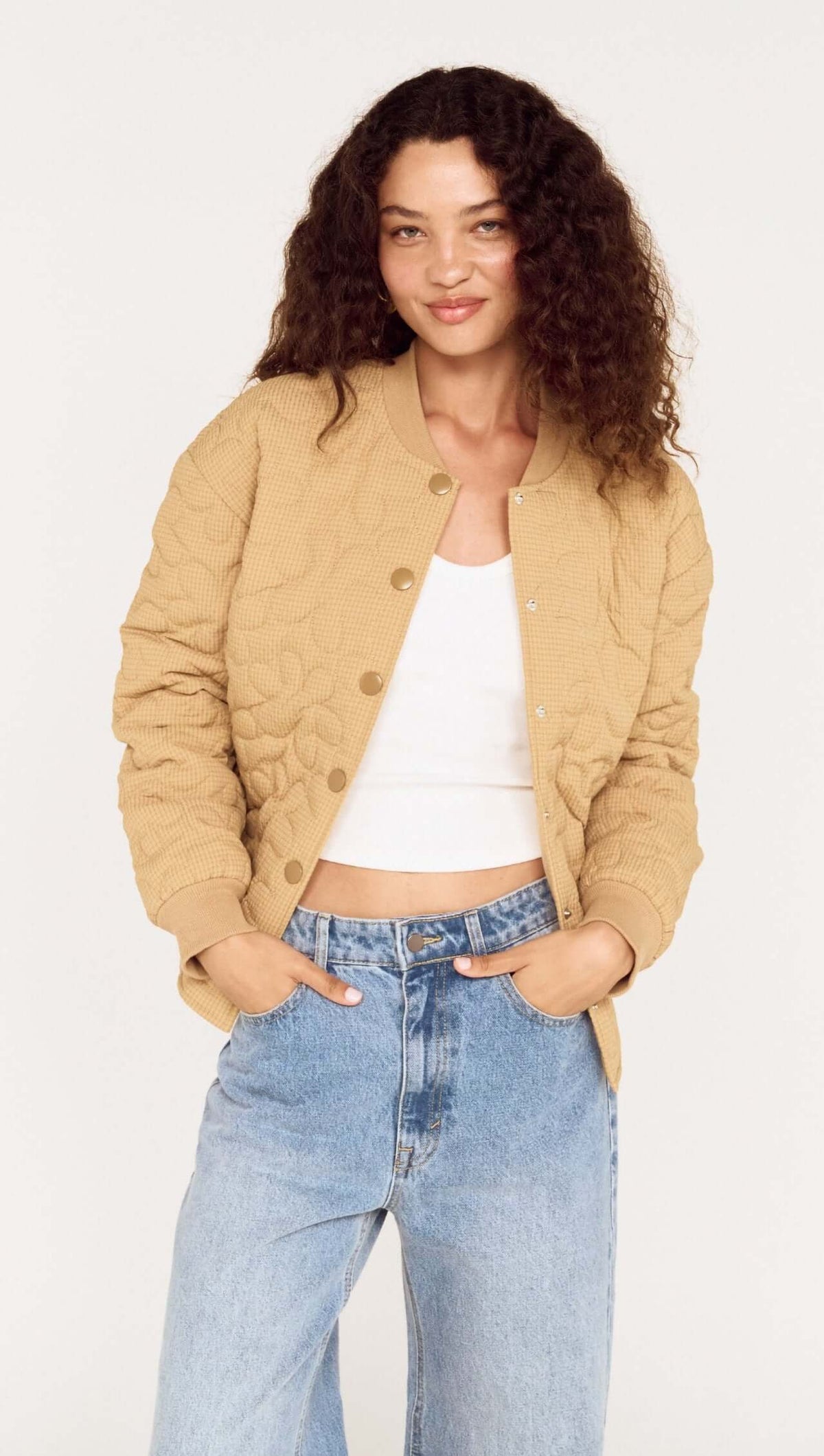 Beige Floral Quilted Puffer Jacket worn by a model, featuring a relaxed fit and soft quilted texture.