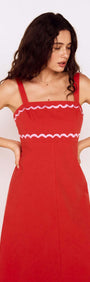 Model wearing a Red and Pink Embroidery Detail Midi Dress with scalloped neckline and straps.