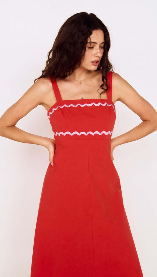Model wearing a Red and Pink Embroidery Detail Midi Dress with scalloped neckline and straps.